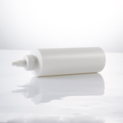 white cylinder round bottle with twist cap