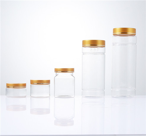 different clear storage plastic jars with yellow cap