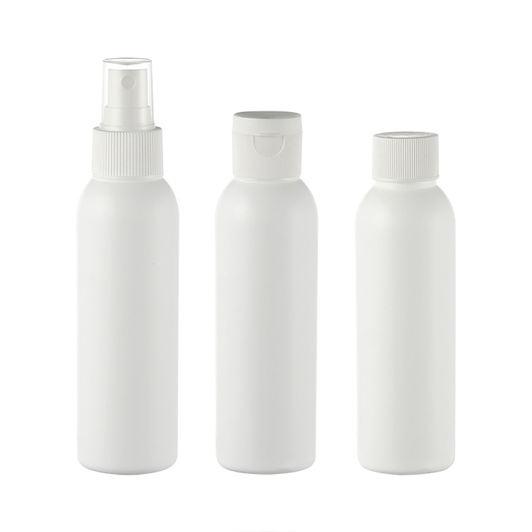 white cosmo shape plastic bottle with flip cap mist sprayer